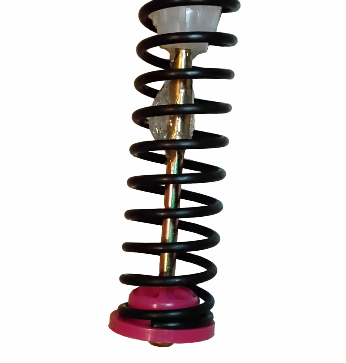 A zoomed in view of the top of the lower pink spring rest on an aftermarket replacement for a Samsung DC97-16350E top-load washer suspension rod. 