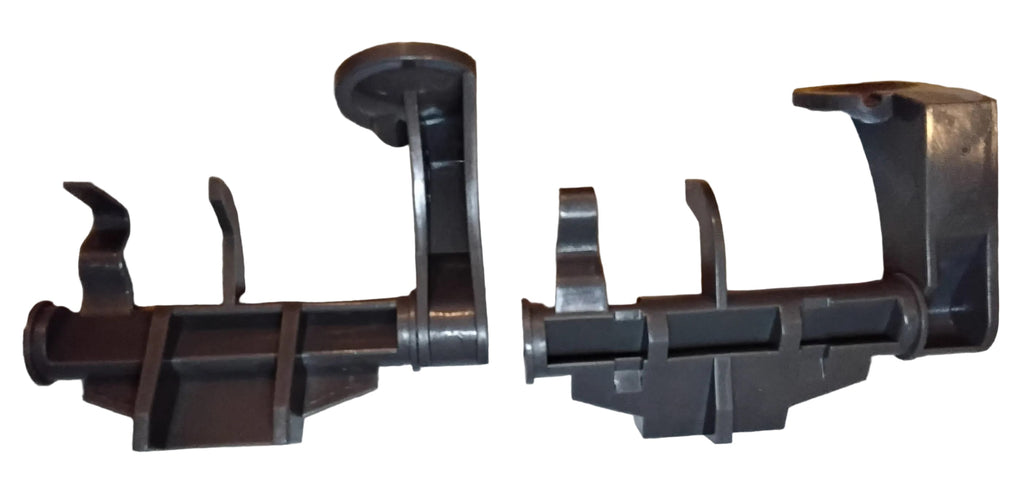 Two identical grey plastic rack adjuster thumb tabs in opposie orientations so that both sides of the part is visible. From an aftermarket substitute for a Whirlpool W10712395 Upper Rack Adjuster Kit